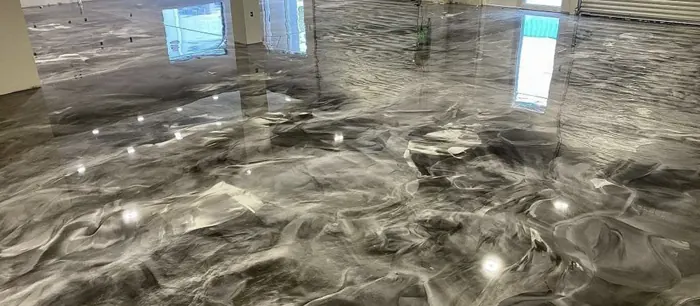Close-up of a glossy smoky pewter metallic epoxy floor